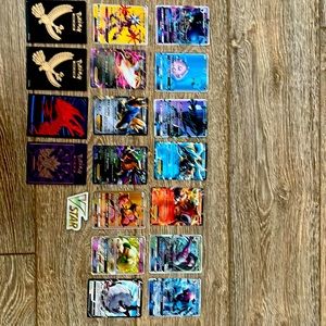 Pokémon cards, sleeves, and a collectible.